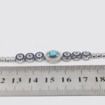 Women’s silver Nishaburi turquoise bracelet with coral design