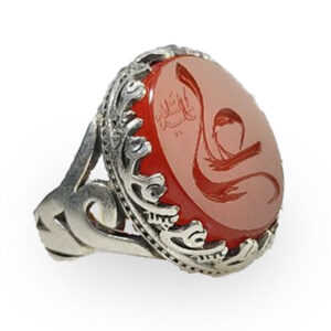Red Agate with modern typographic engraving of "علی". Metal: 925 Sterling Silver. Total Weight: 9 grams (lightweight comfort). Engraving Style: Contemporary graphic/typographic treatment. Stone Color: Vibrant Red Agate. Design Ethos: Modern minimalist with spiritual core.